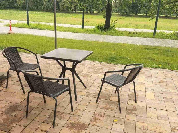 Completed concrete patio with outdoor seating area and clean paver layout in Parma Heights, OH