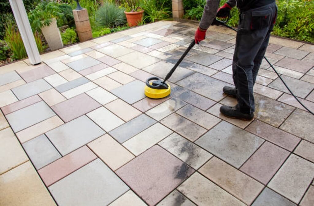 Cleaning and sealing decorative stamped concrete patio surface in residential backyard in Parma Heights, OH