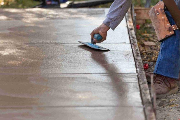 Newly installed concrete driveway with smooth finish and clean layout at residential home in Parma Heights, OH